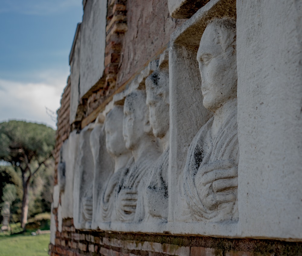 a stone wall with a carved face