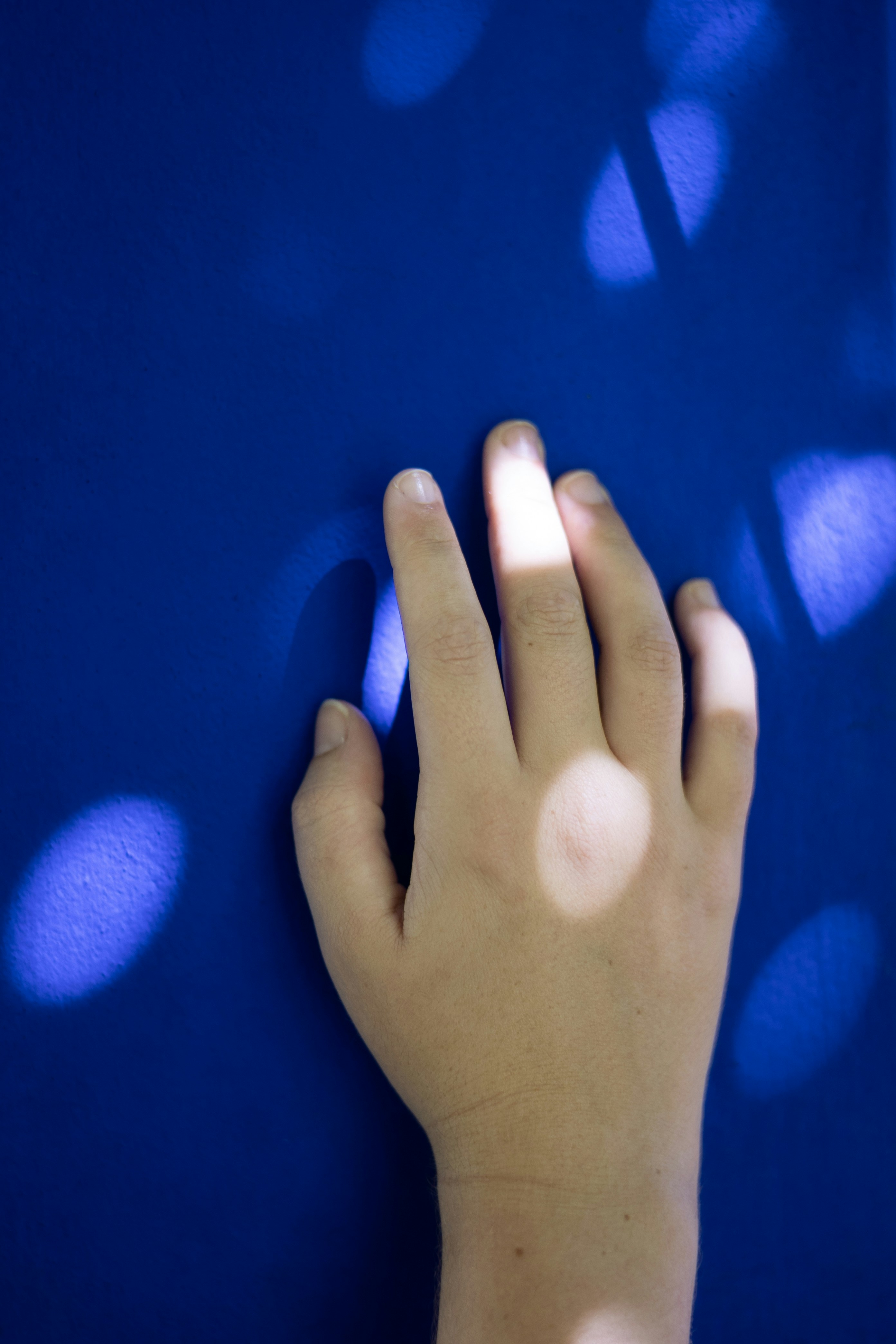a hand with a blue background