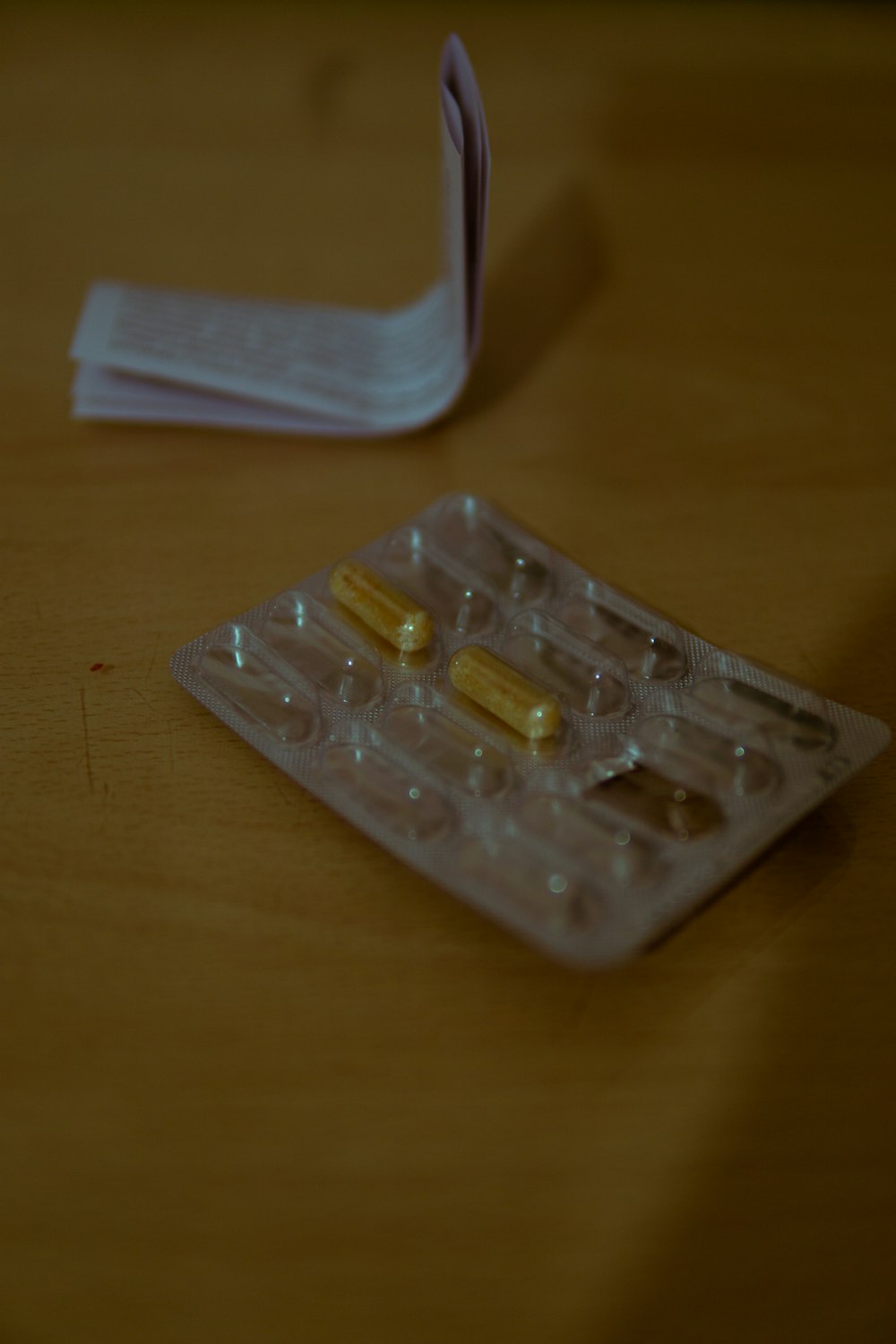 a clear plastic container with a clear lid and a plastic bag with a white lid on a wooden