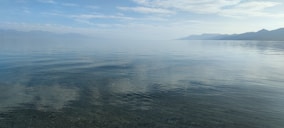 A serene view of Sempachersee with calm waters.