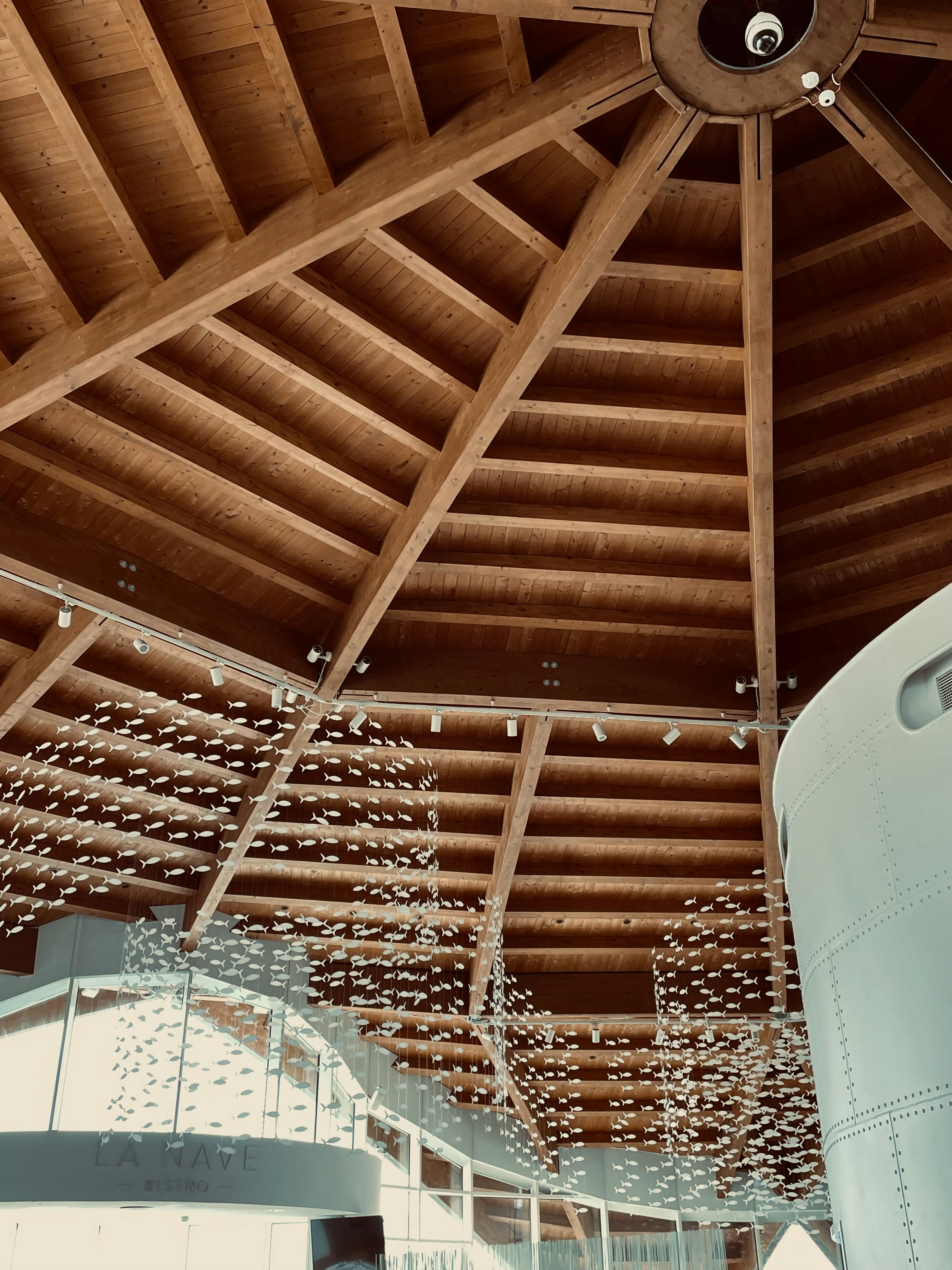 a large room with many floors and a pool