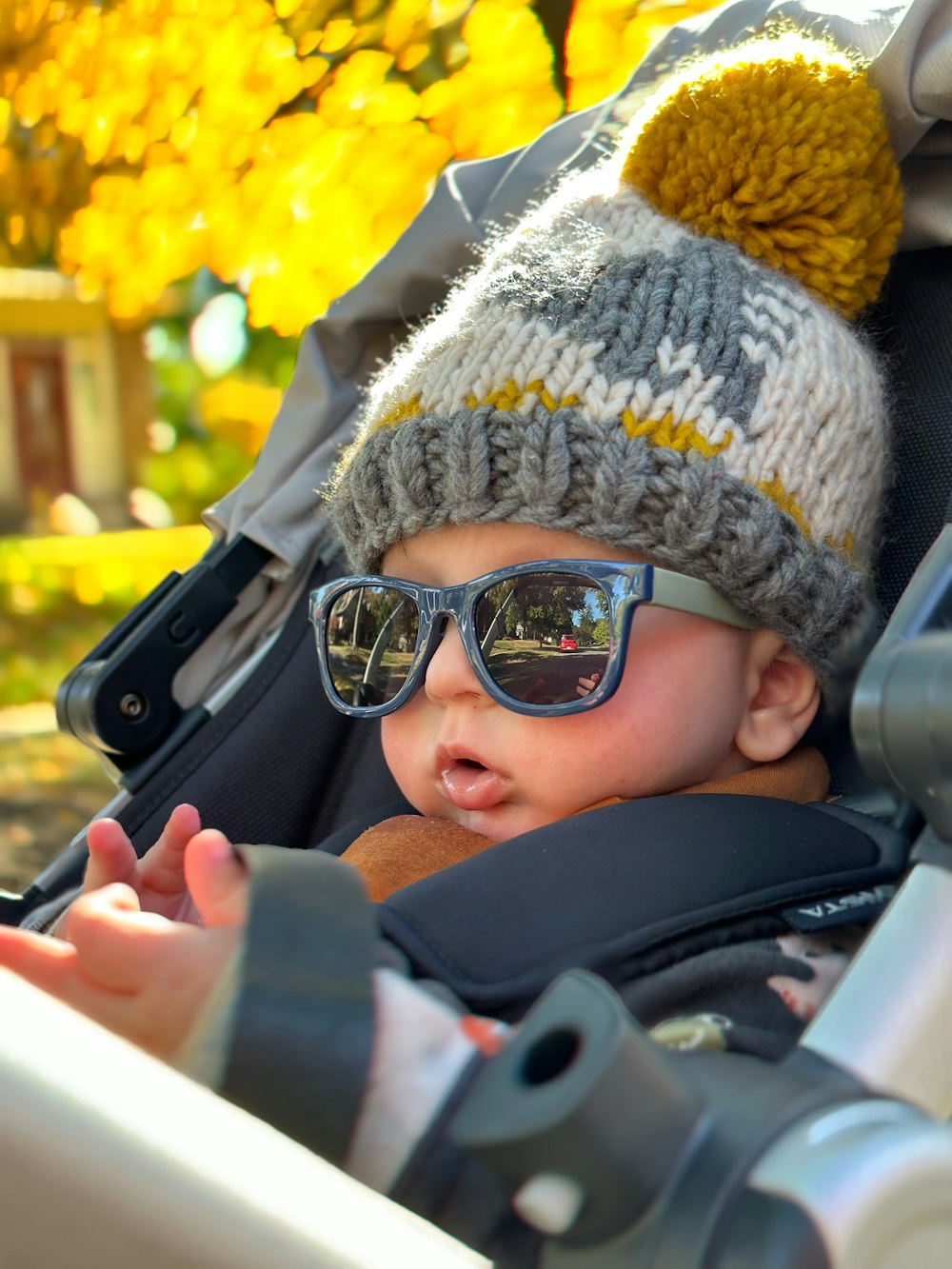 a baby wearing sunglasses and a hat