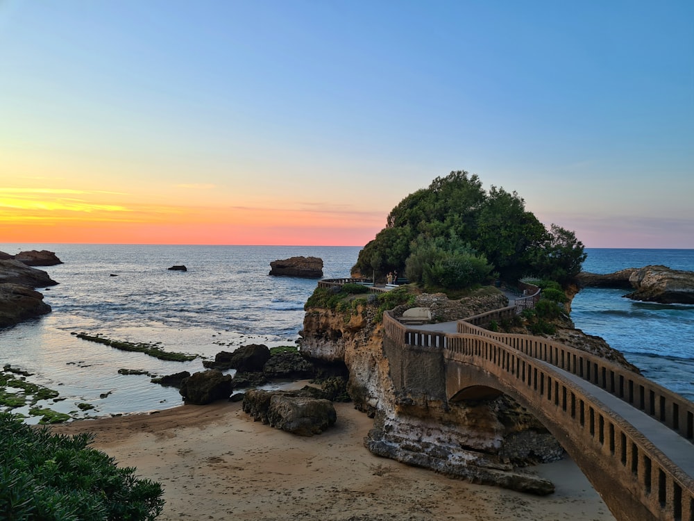 a wooden walkway over a beach