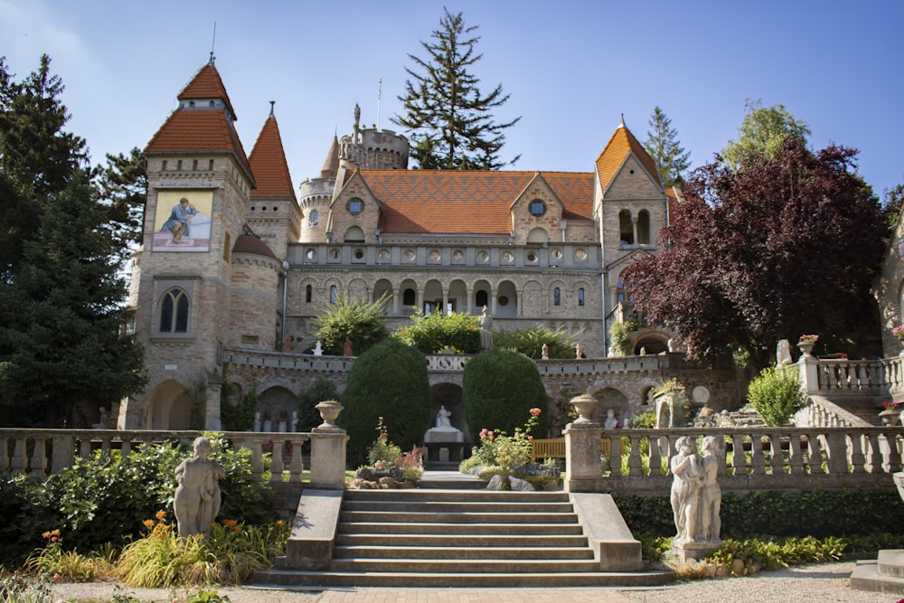 a large building with a garden in front of it