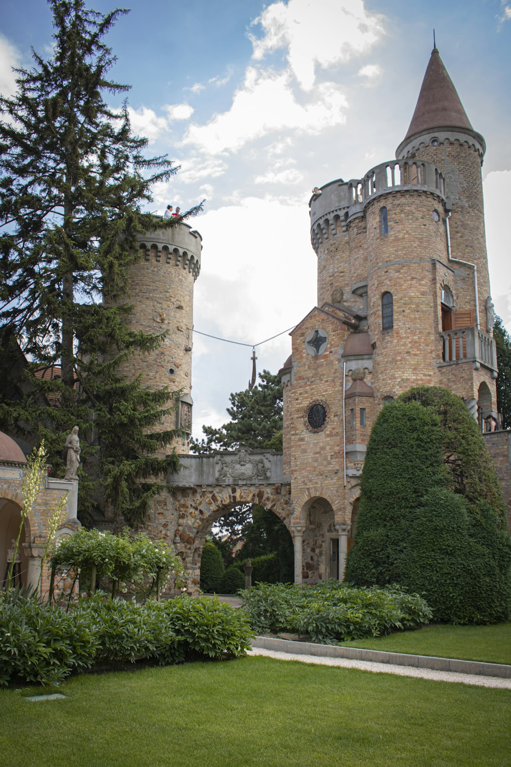 a large castle with a lawn in front of it