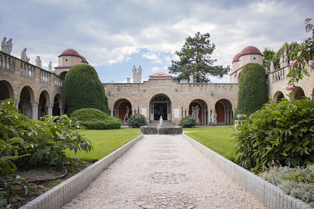 a stone pathway leading to a building