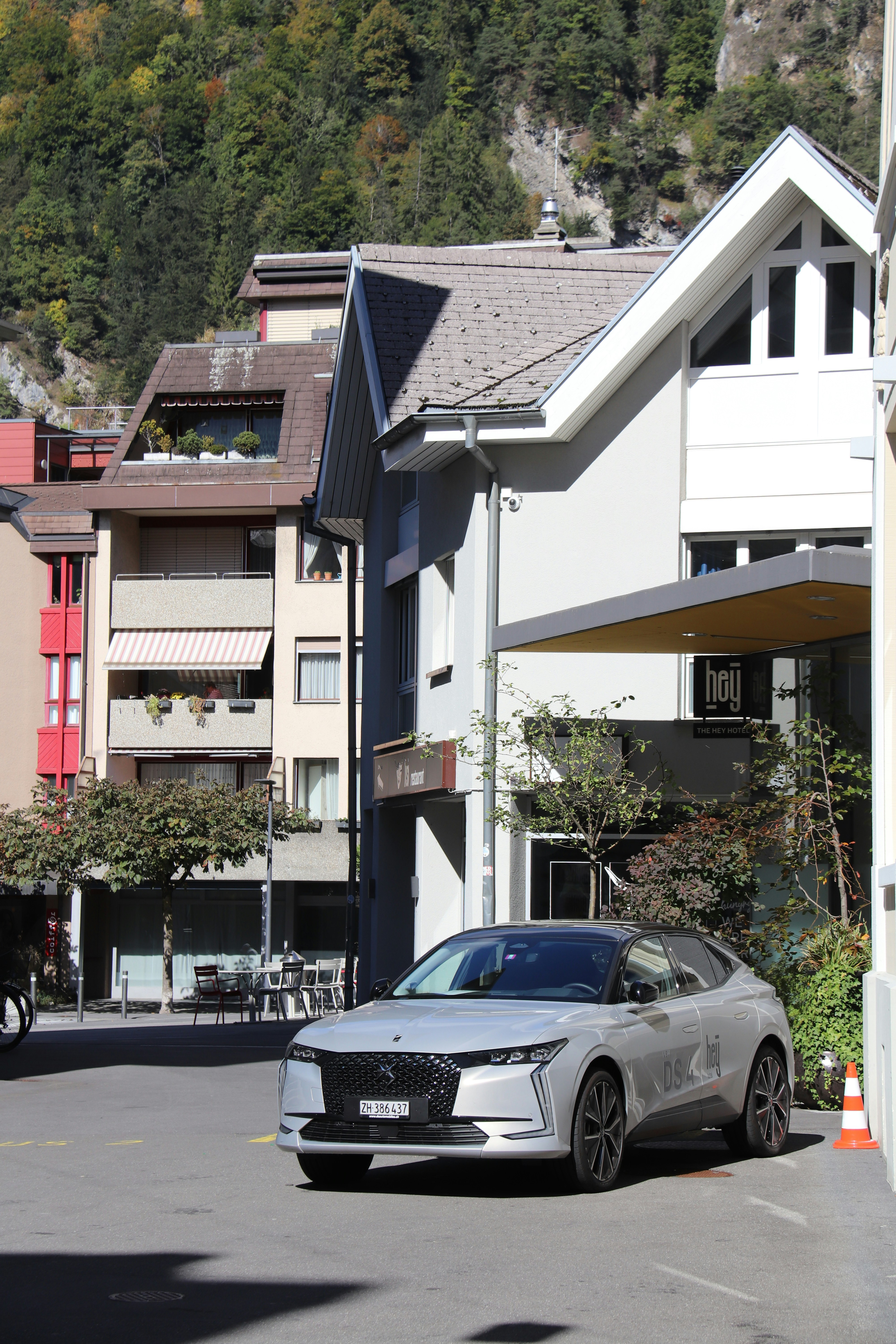 A car parked in front of a building photo Free Interlaken Image on