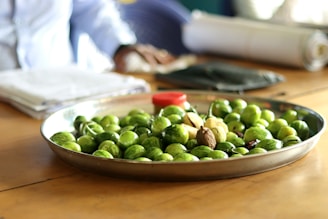 a bowl of green olives