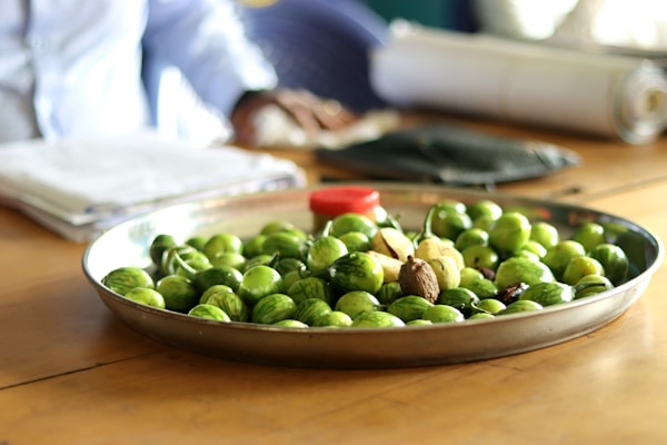 a bowl of green olives