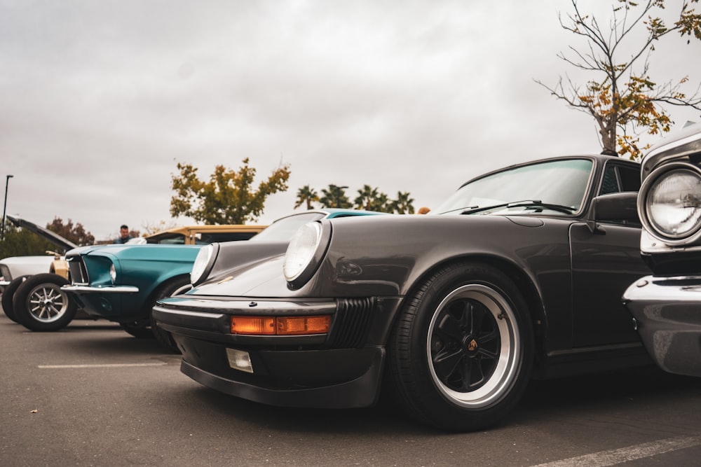 a black car parked next to other cars