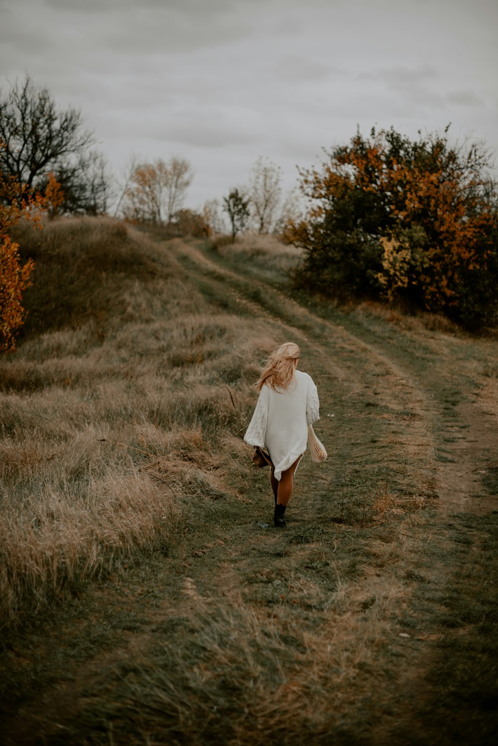 a person walking on a dirt path