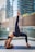 a woman doing yoga outside