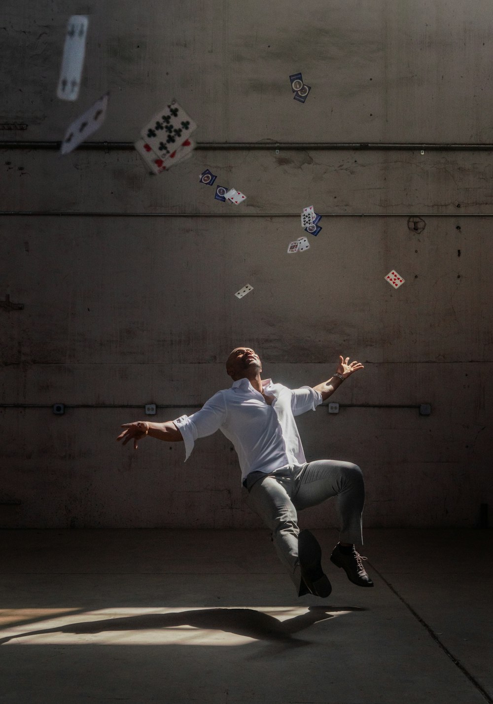 a man jumping in the air with kites in the air