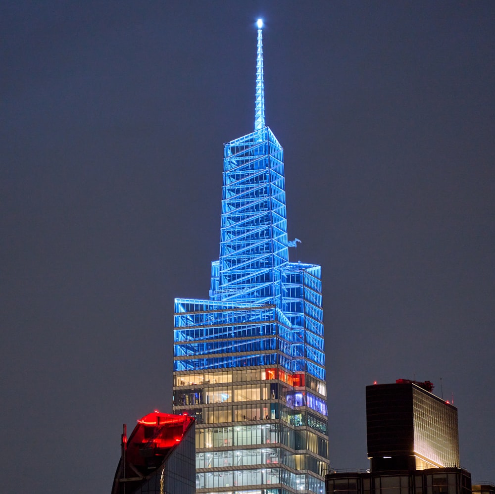 a tall building with lights at night