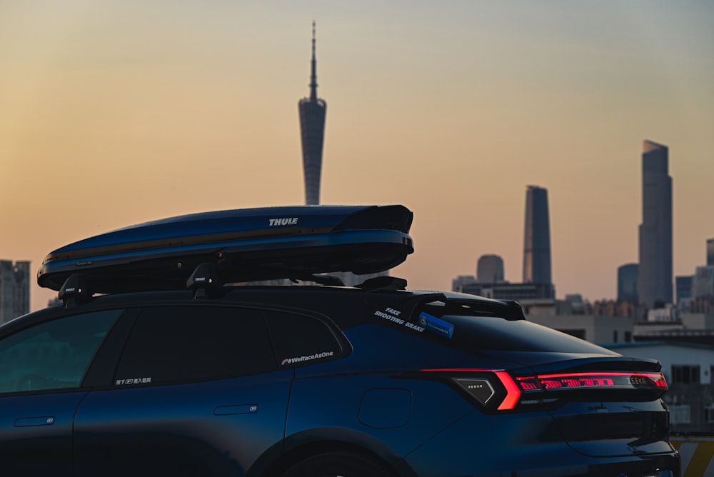 a car with a city skyline in the background
