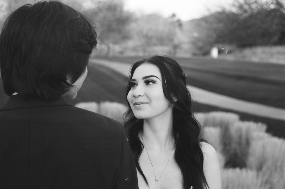 a man and woman looking at each other