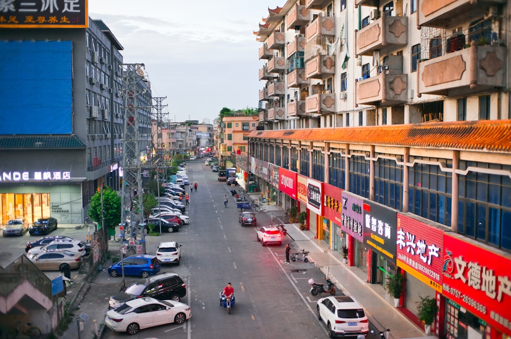 a busy street with cars and people