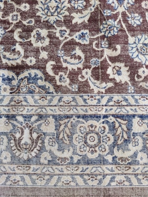 A beautiful carpet showcasing intricate designs in soft colors, perfect for any room.
