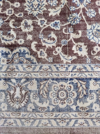 Handwoven carpet featuring traditional Turkish designs.