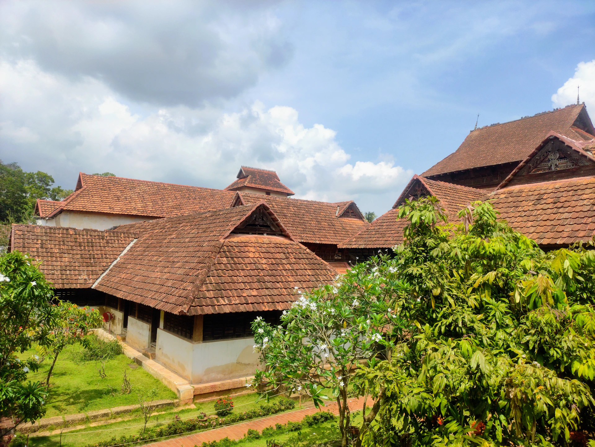Padmanabhapuram Palace with a garden in front of it