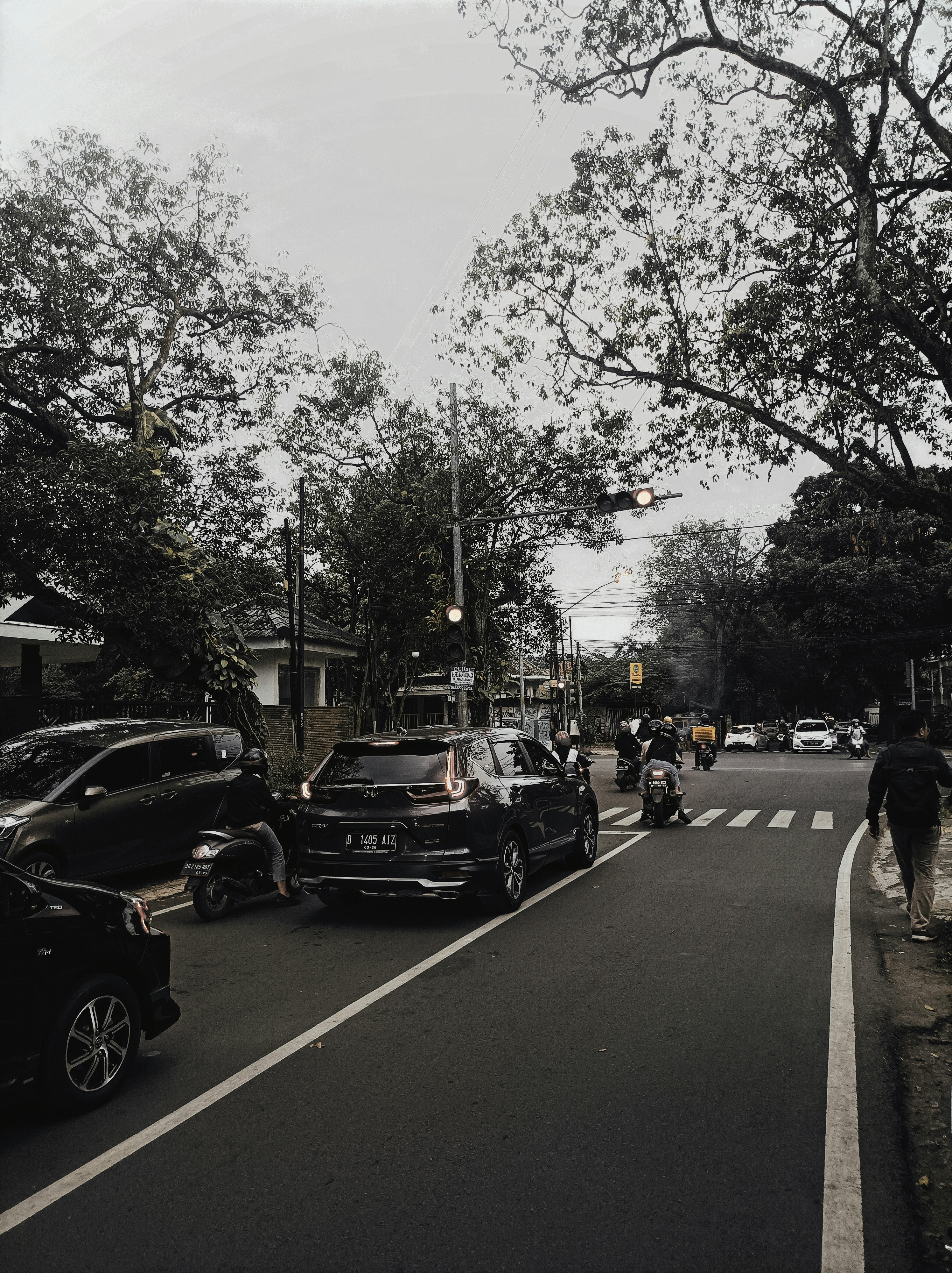 a street with cars and people on it