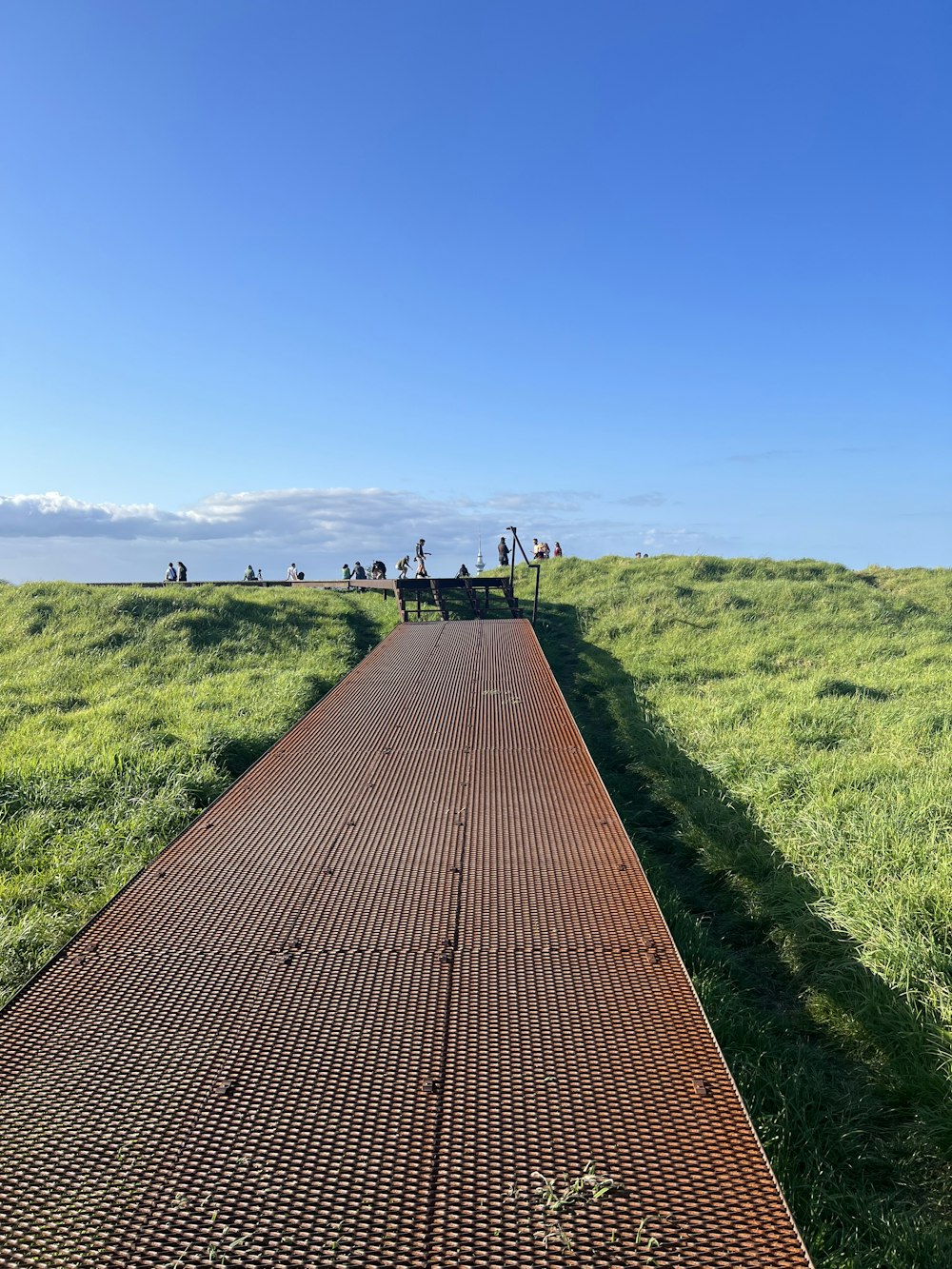 a long straight road with people on it