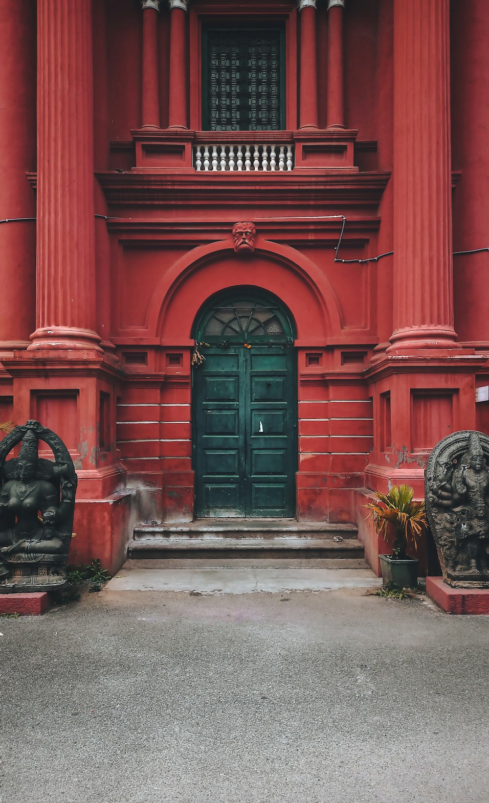 a red building with a green door