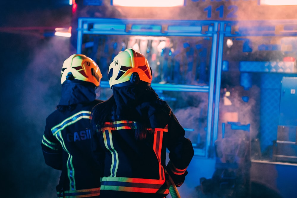 a couple of people wearing helmets