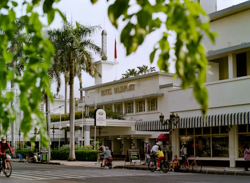 a group of people riding bikes on a street