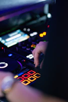 a hand holding a black device