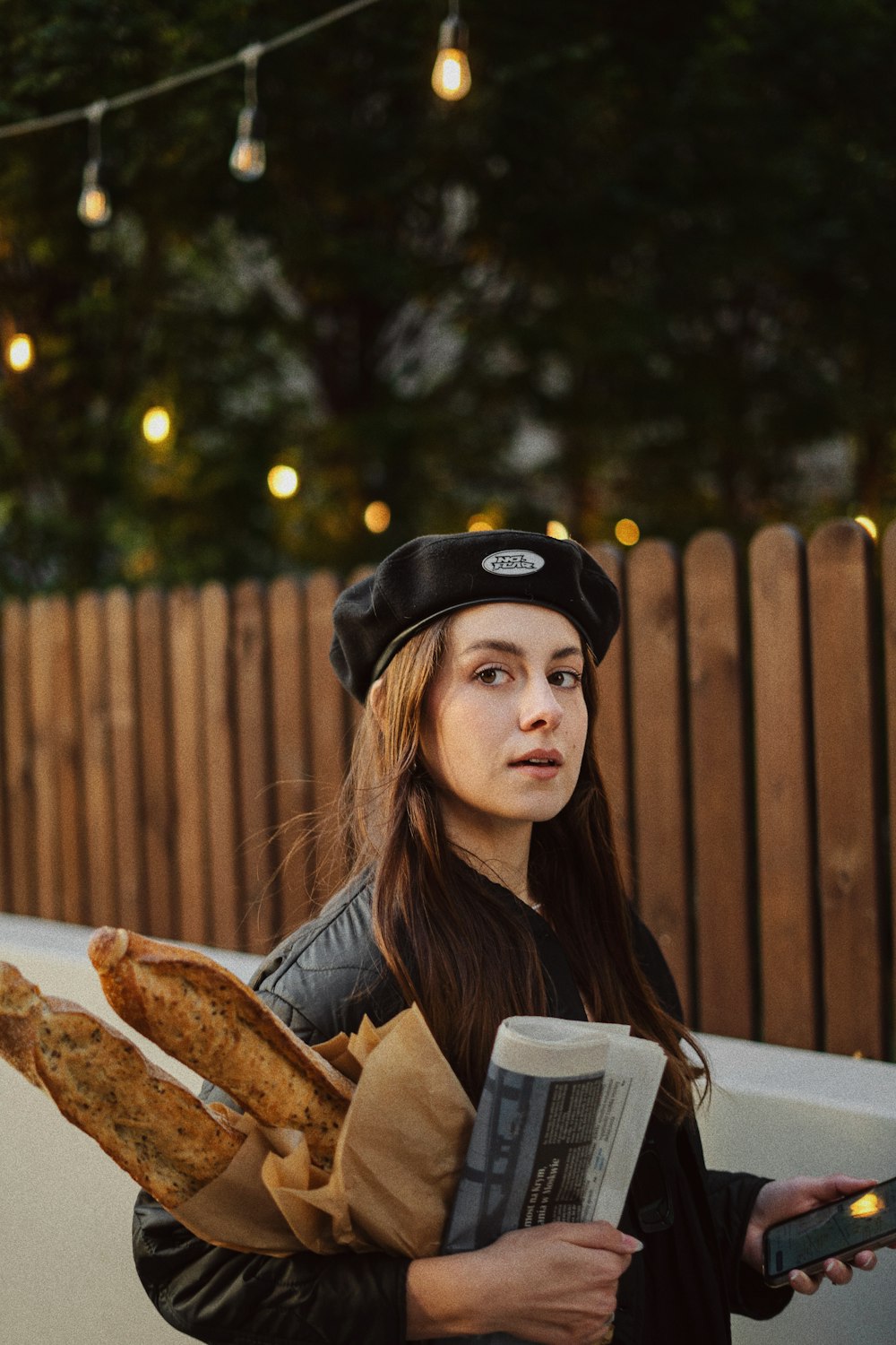 a person holding a hot dog