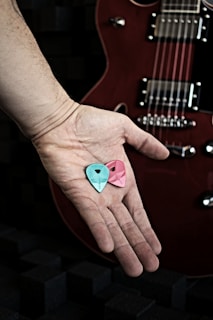a person's hand with painted nails