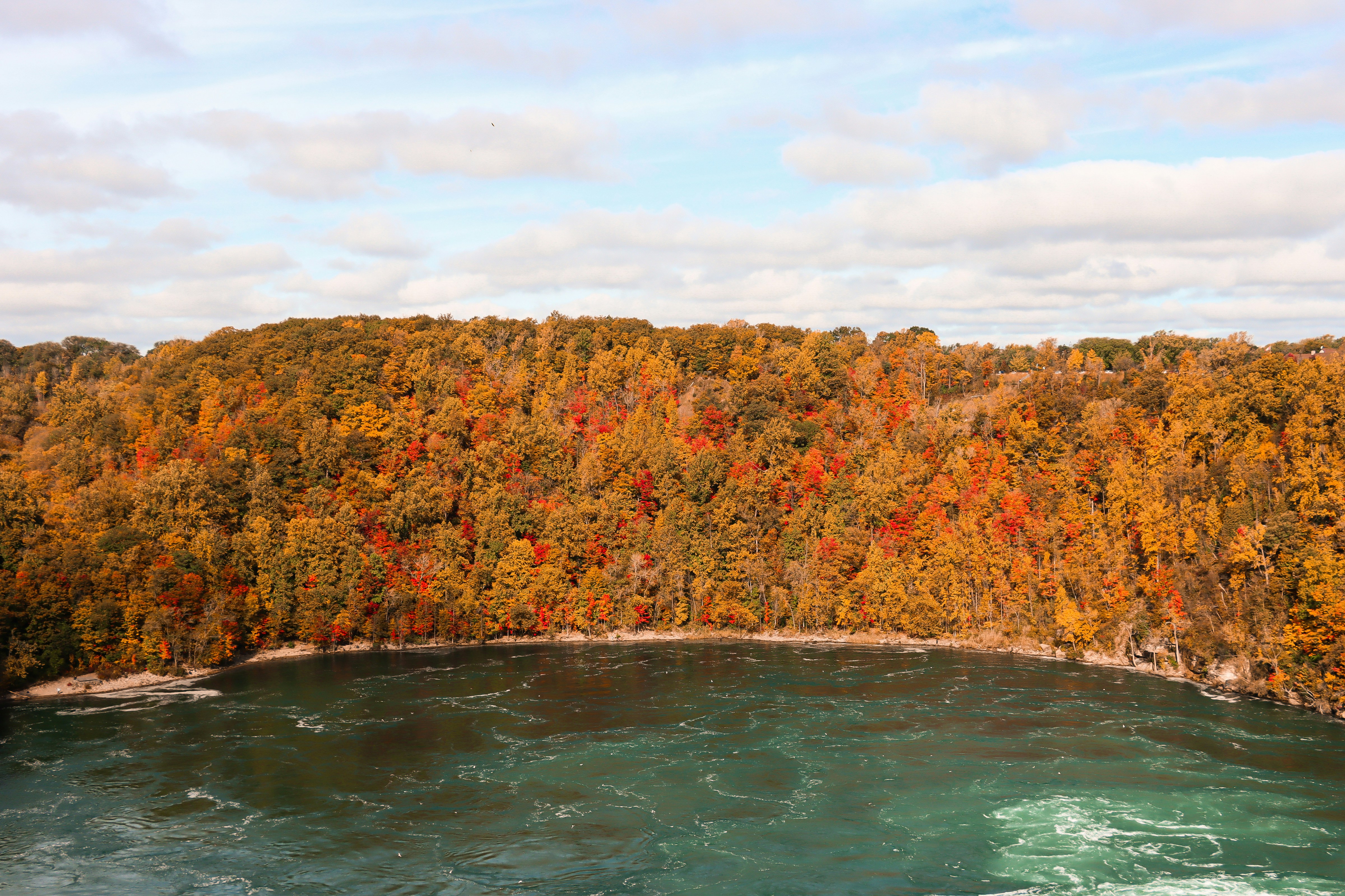 a body of water with trees around it, Niagara
