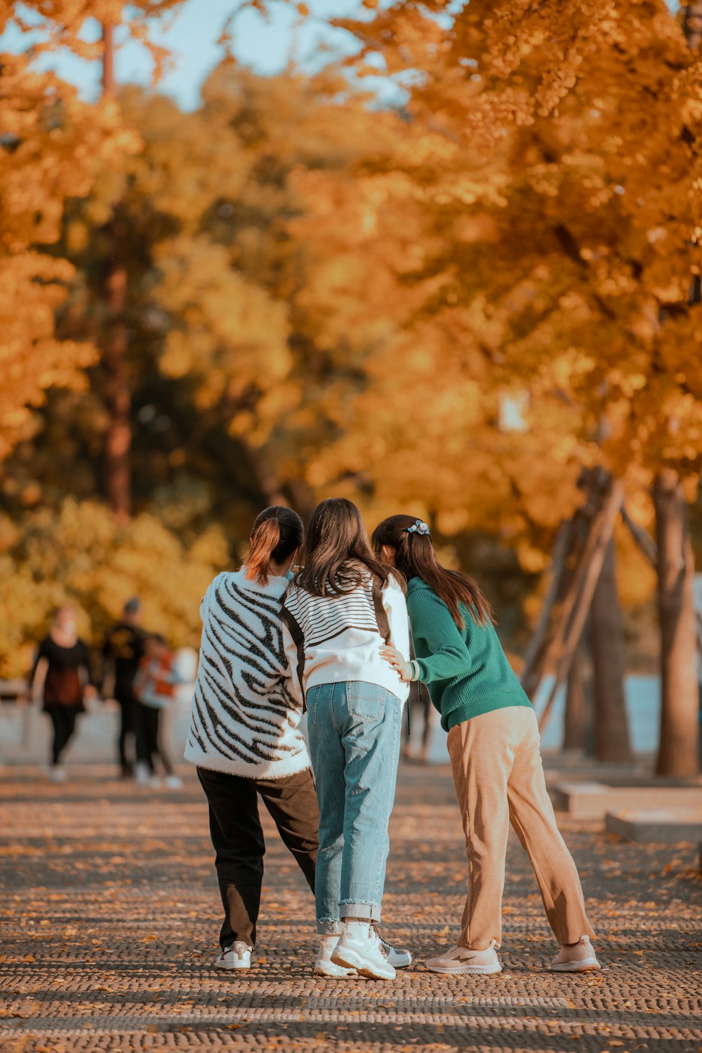 a group of people standing in a park