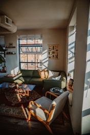 a living room with a couch and chairs