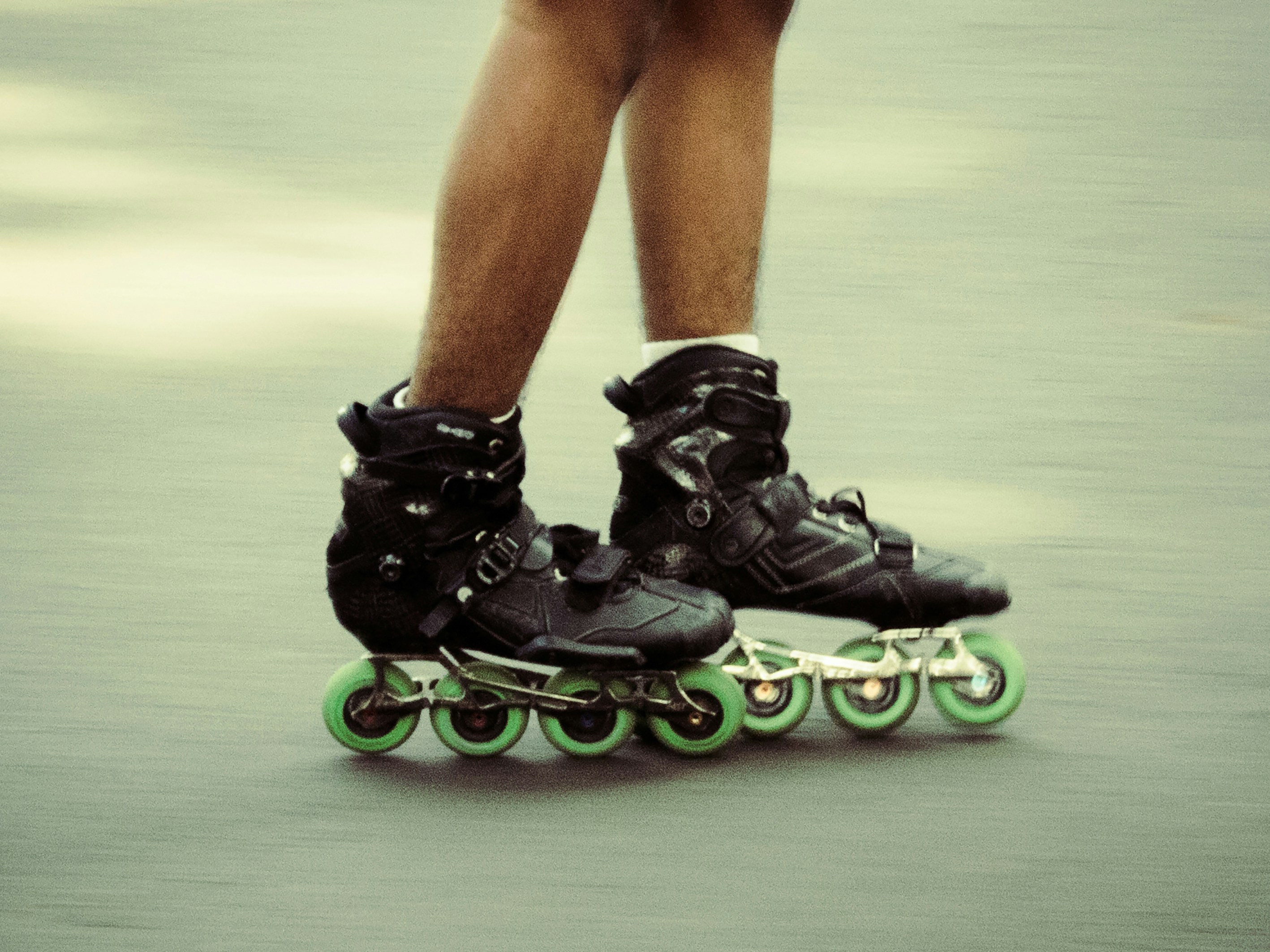 a pair of legs on a skateboard