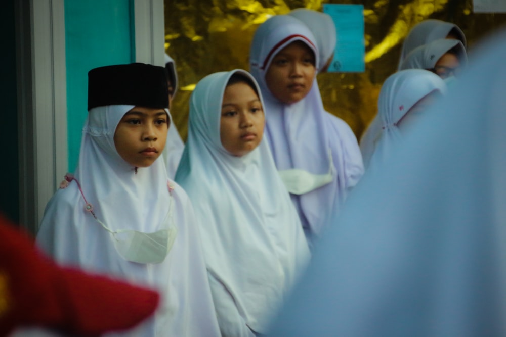 a group of women in white robes