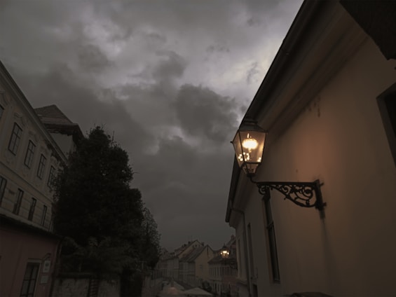 A warm, inviting street scene in Kolkata with traditional homes and bustling local life under soft golden light.