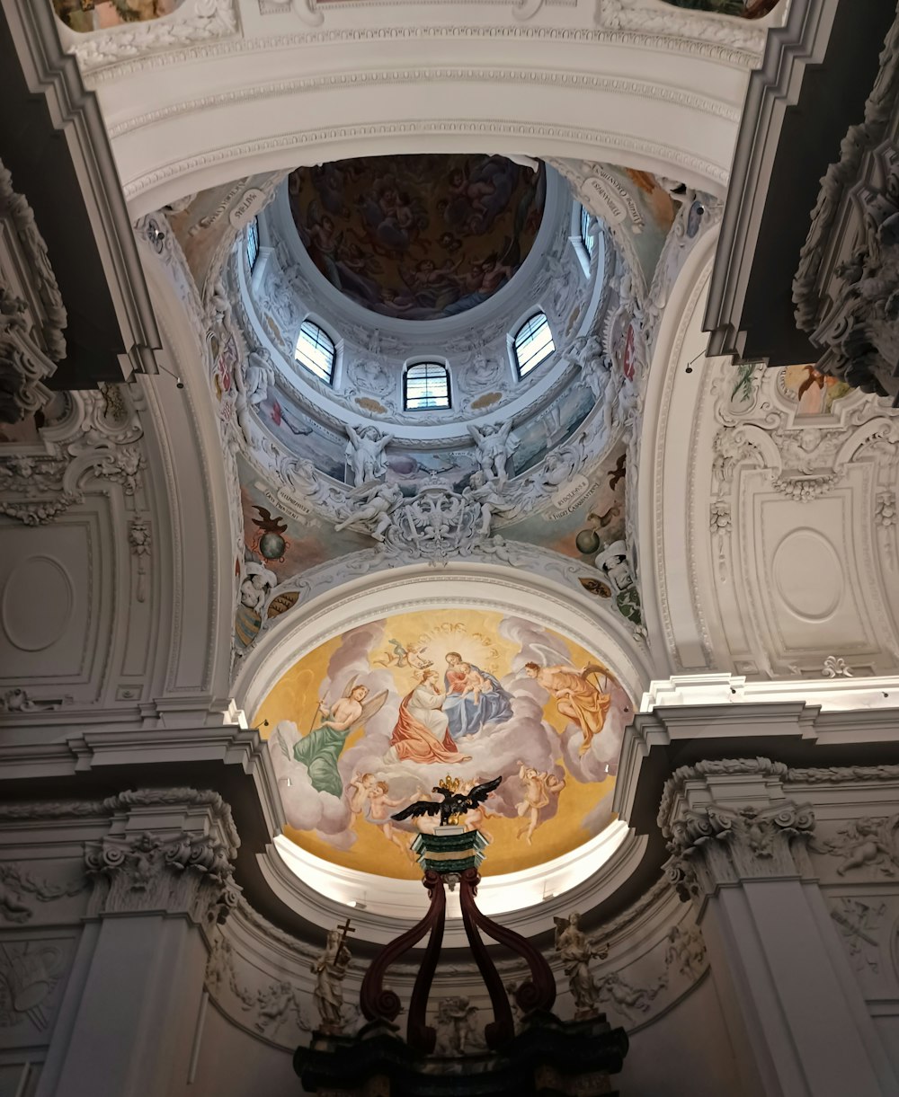 a large ornate ceiling with a painting