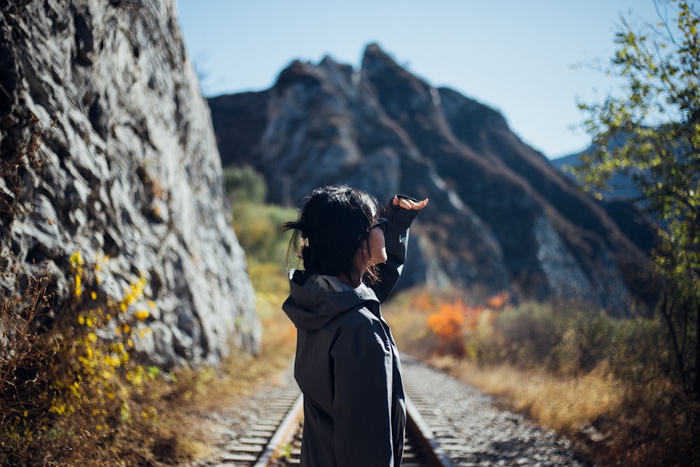 a man standing on a train track