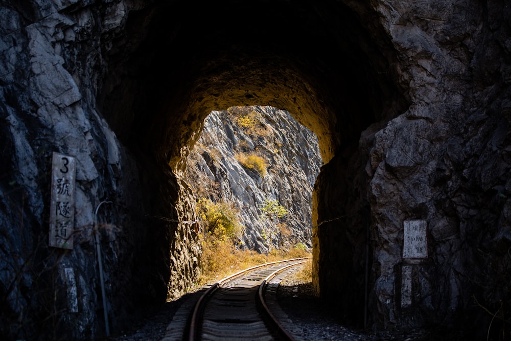 a tunnel with a train track