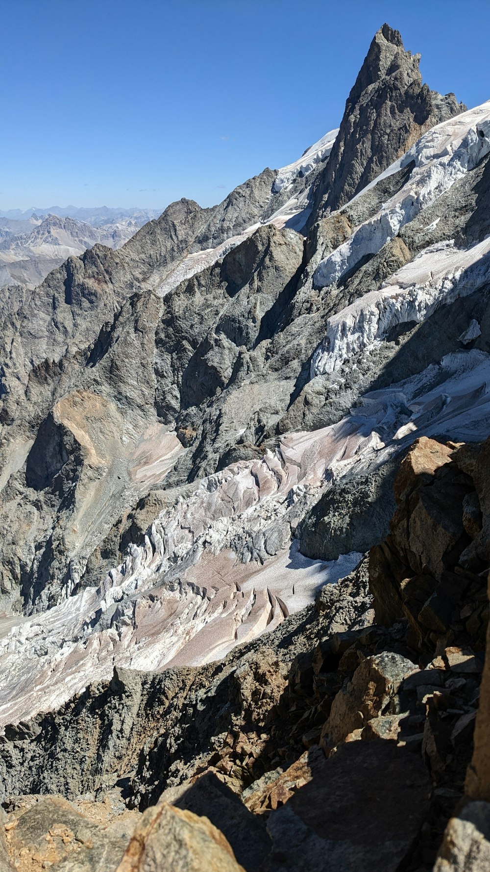 a rocky mountain with snow