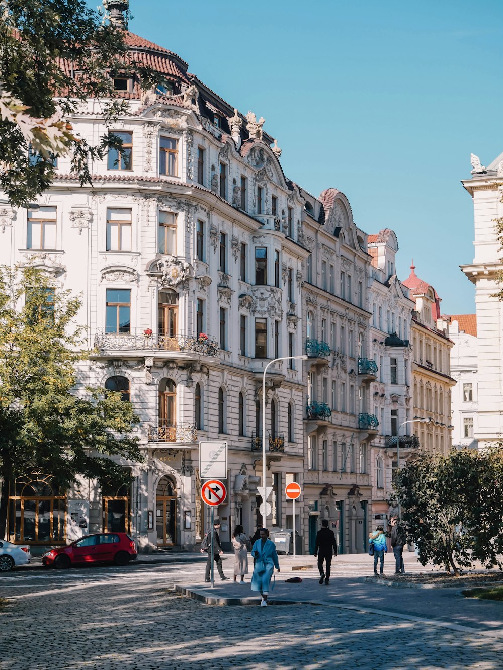 a street with people and buildings on the side