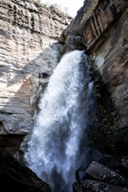 a waterfall in a canyon