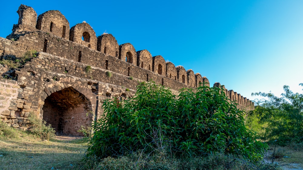 a stone building with a tunnel