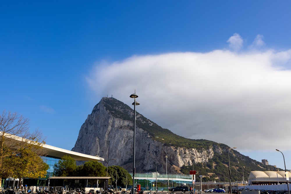 a large mountain with clouds