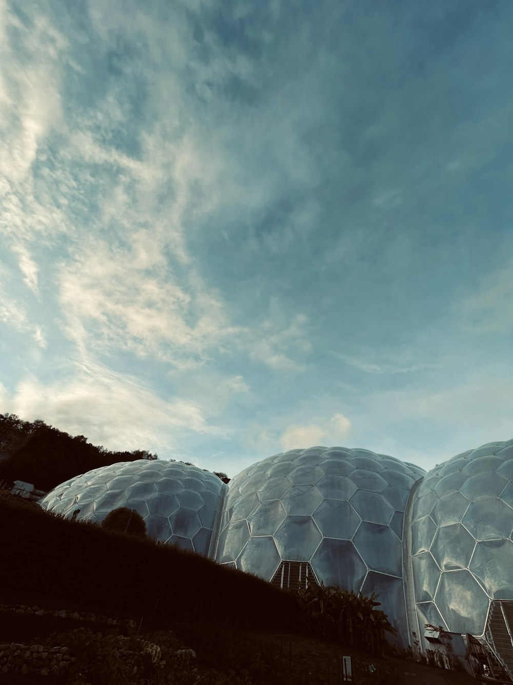 a large white dome with a blue sky above it