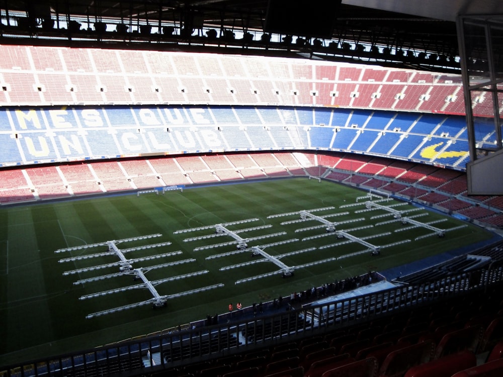 a sports stadium with a green field