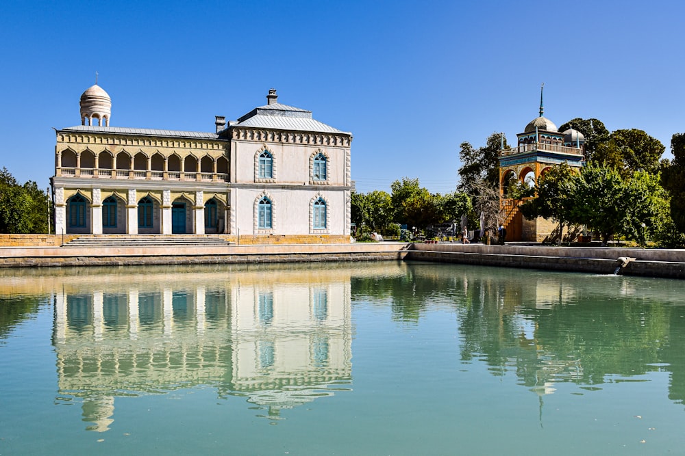 a building with a pool of water in front of it