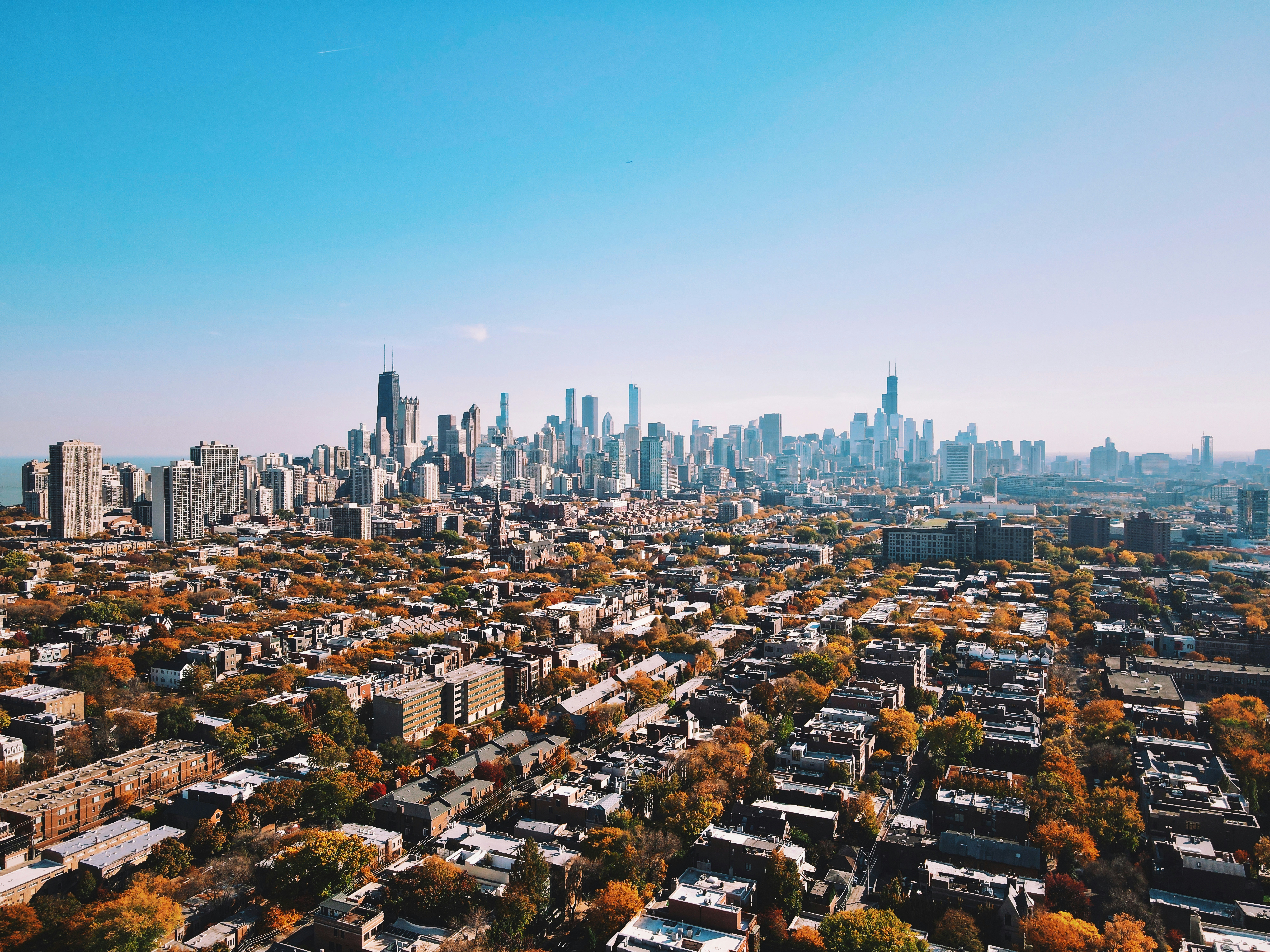 a city skyline with a blue sky